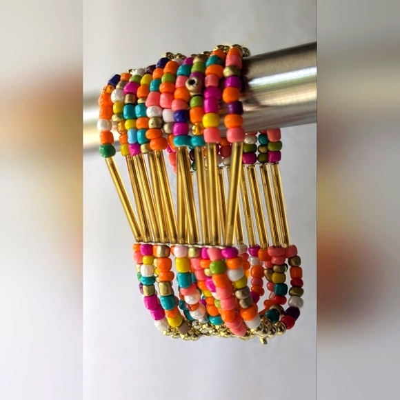 Jewelry - Stretchy Cuff bracelet composed 10 rows of multicolored beads.